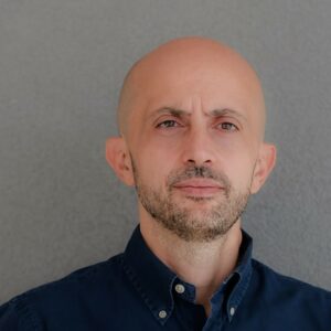 Portrait of a man against grey background